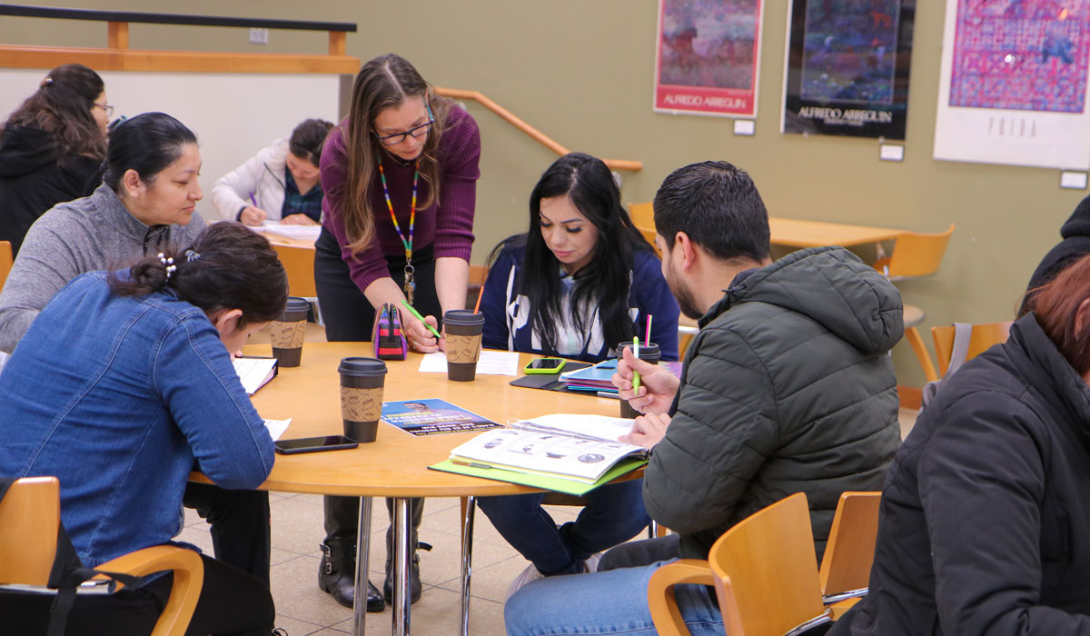 Instructor works with small group of students