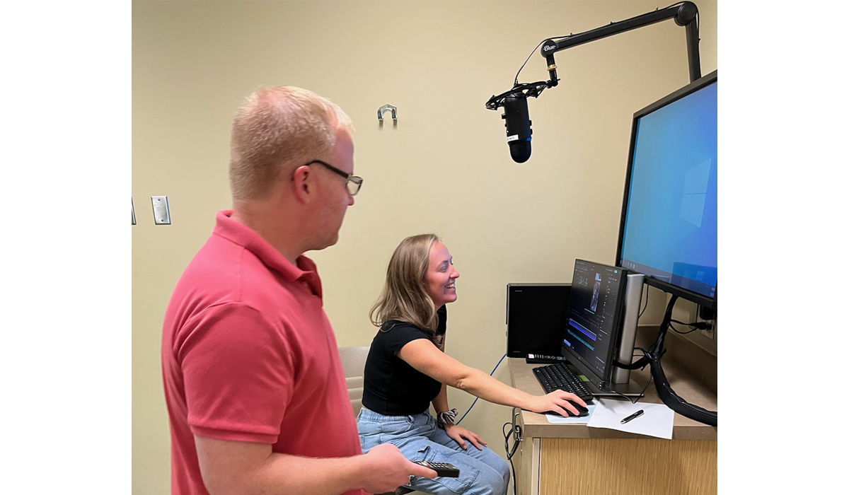 Two people working in the YVC Speech Lab.