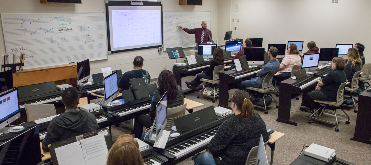 YVC music instructor teaches during piano class