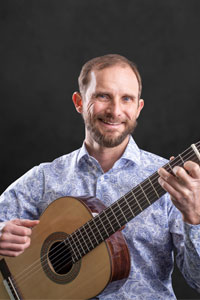 John Paul Shields poses for pictured with his guitar