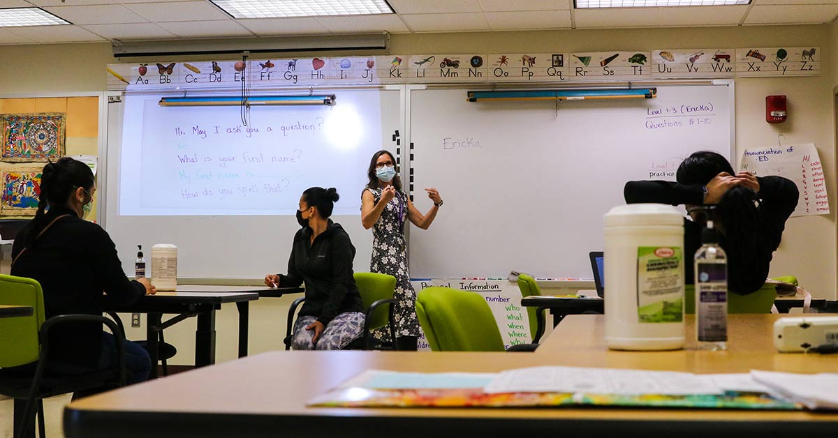 Instructor in front of whiteboard