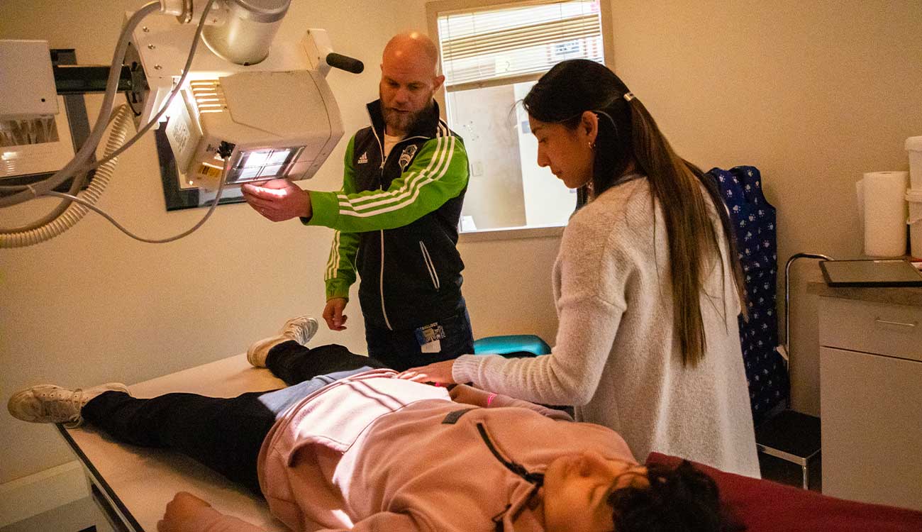 Radiologic sciences student practices taking an image of patient