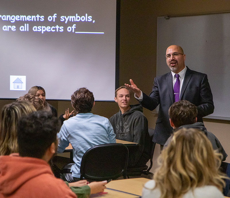 Instructor Keith Reyes speaks in a class