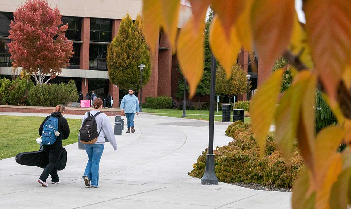 Students walking on YVC campus during the fall. 