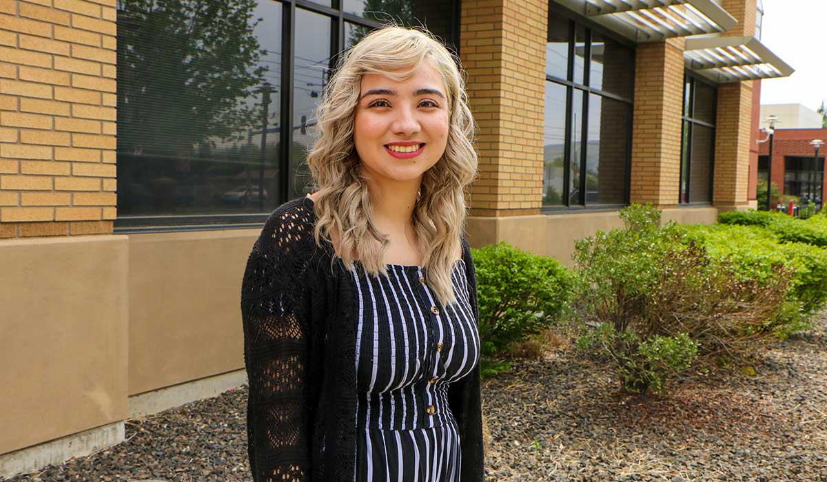 Lucero Mendez poses for a picture on campus