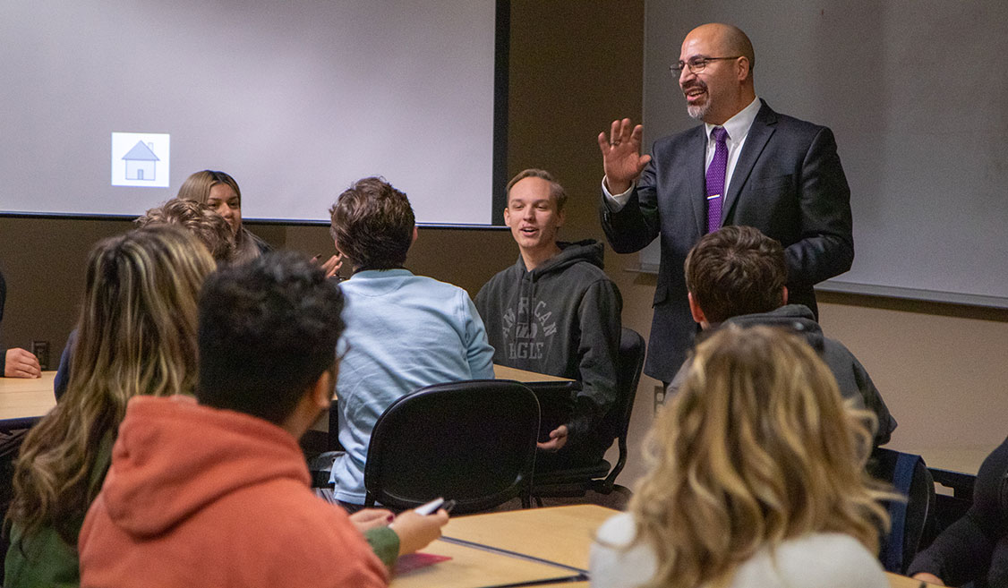 Sociology Instructor Keith Reyes lectures to students during class