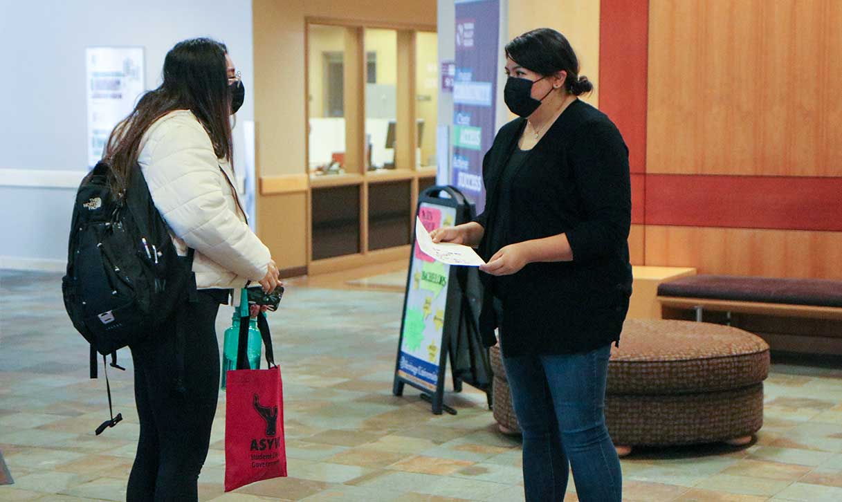 Student getting help at welcome event