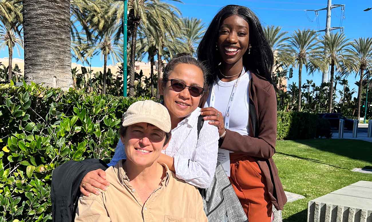 Claire Carpenter and Panyada Sullivan with student Biba sarr. 