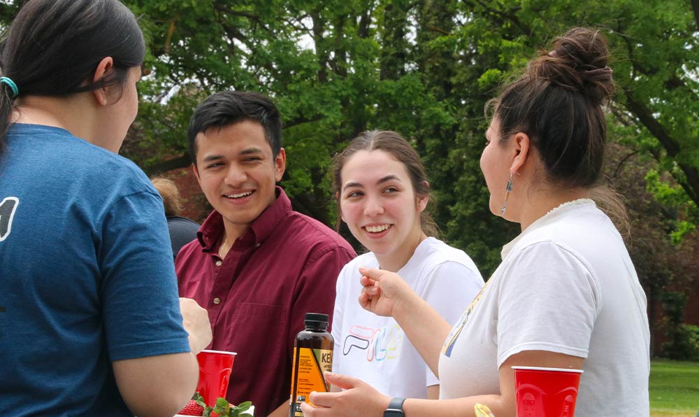 Students talk at picnic