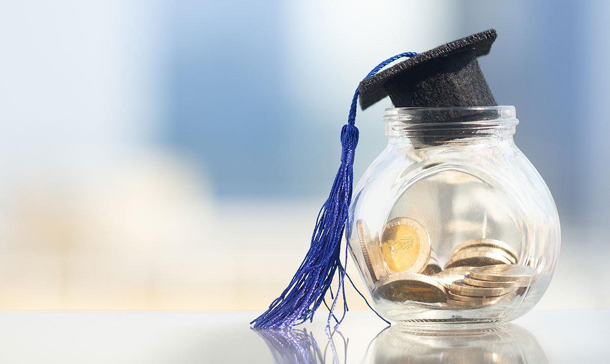 Graduation hat with jar full of money