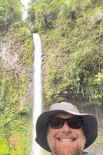 YVC Instructor Brock Eubanks with La Fortuna waterfall in background