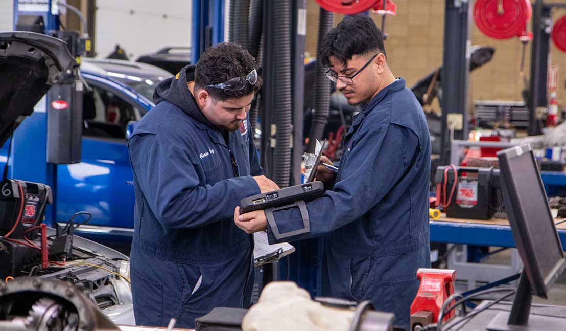 Automotive Service Technology students review diagnostics during lab