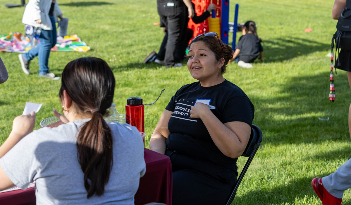 YVC students socialize during campus event outside. 