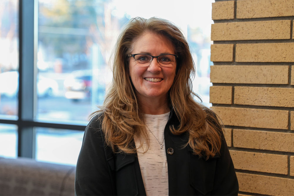 Teana Robbins poses for headshot in a YVC Academic Building