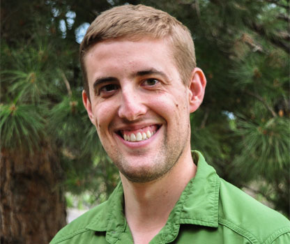 Zach Schierly poses for headshot. 