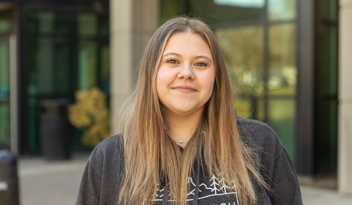 Zoe Harrington poses for Student Story picture. 