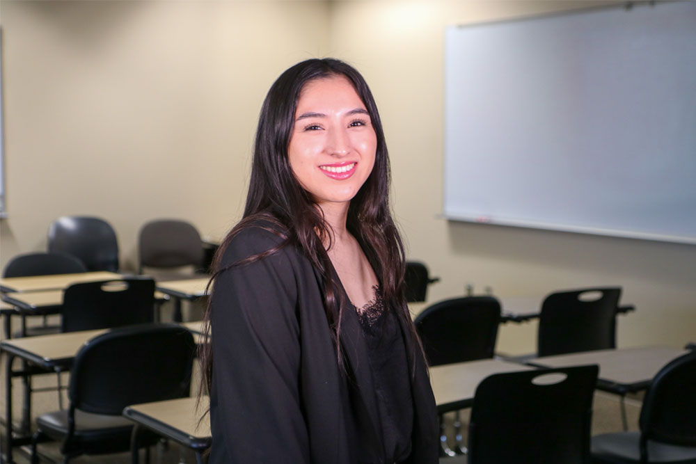 Kyara Rosas-Alejandre poses for Student Story picture in a YVC classroom. 