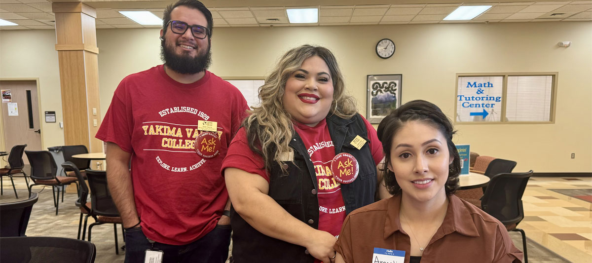 Three YVC staff members pose for picture wearing their YVC shirts. 