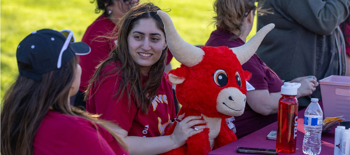 Two students talking on the Yakima Campus During an event. 