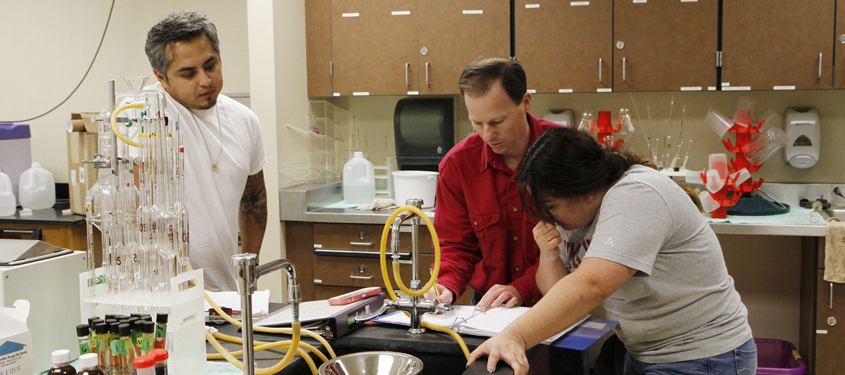 YVC Instructor works with student during an agriculture class at YVC. 